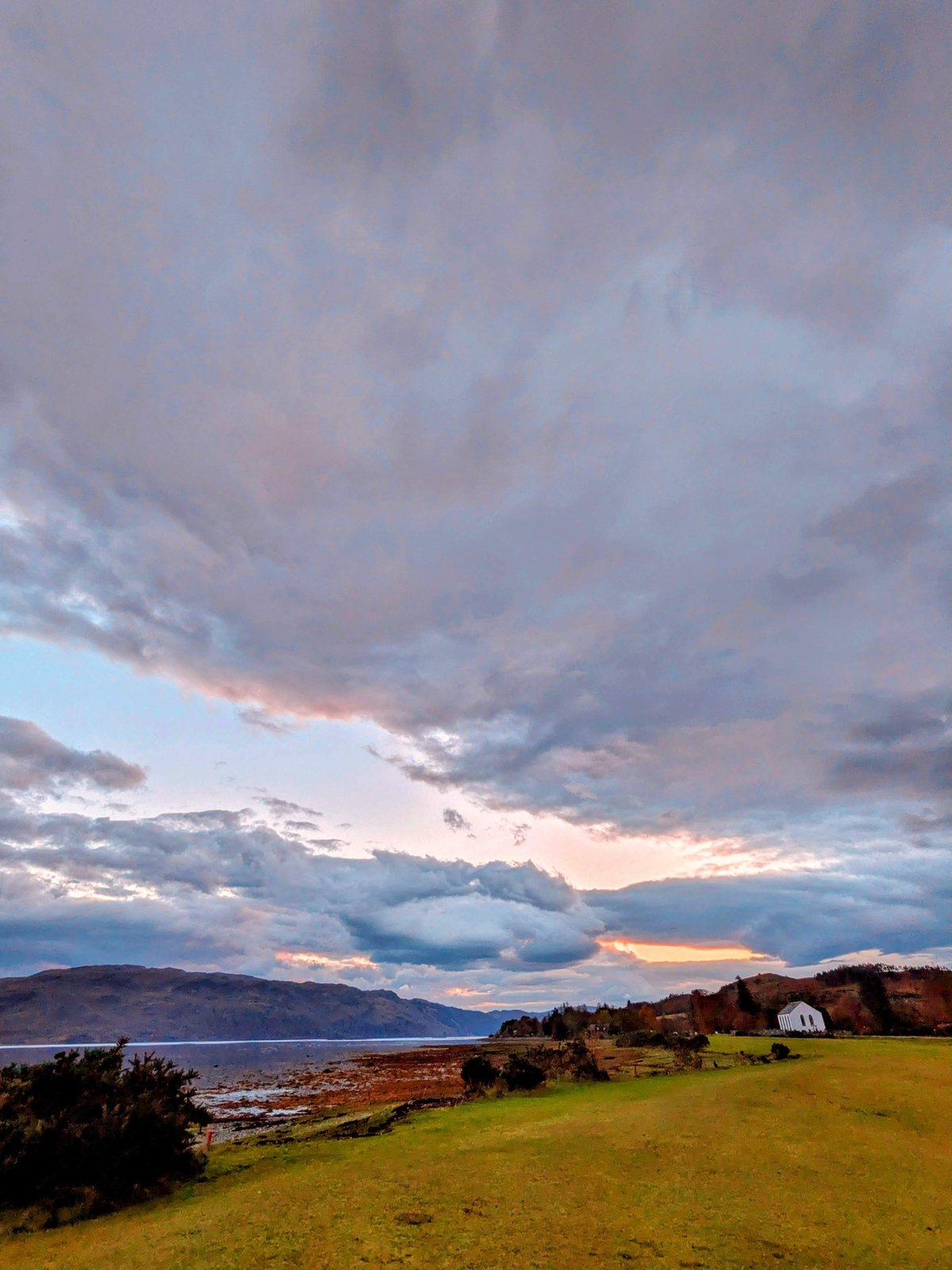 A fiery sunset over the moor and loch at Strathcarron.