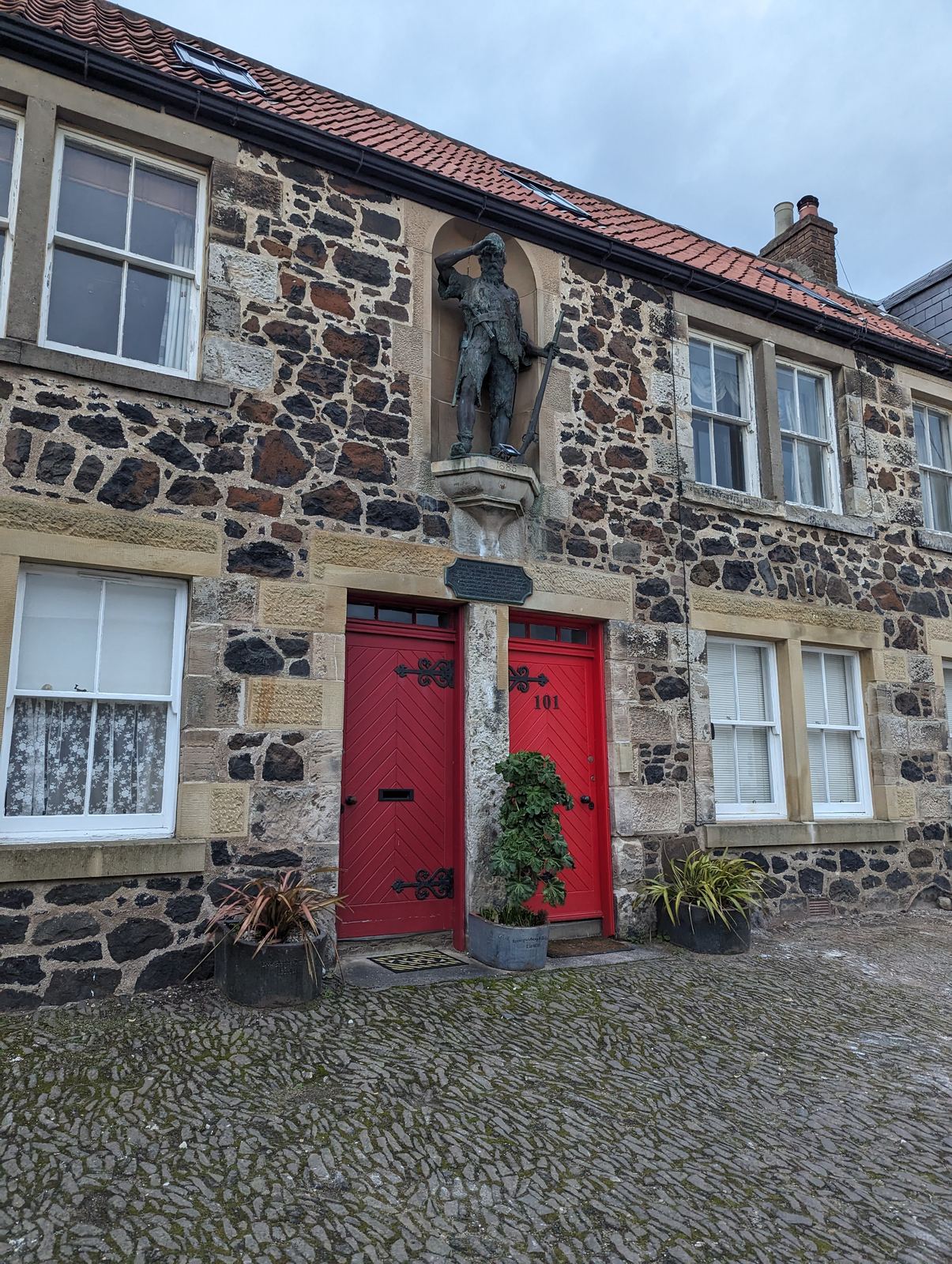 The statue of Alexander Selkirk, the real Robinson Crusoe, above the door of his birthplace house on Main Street, Lower Largo