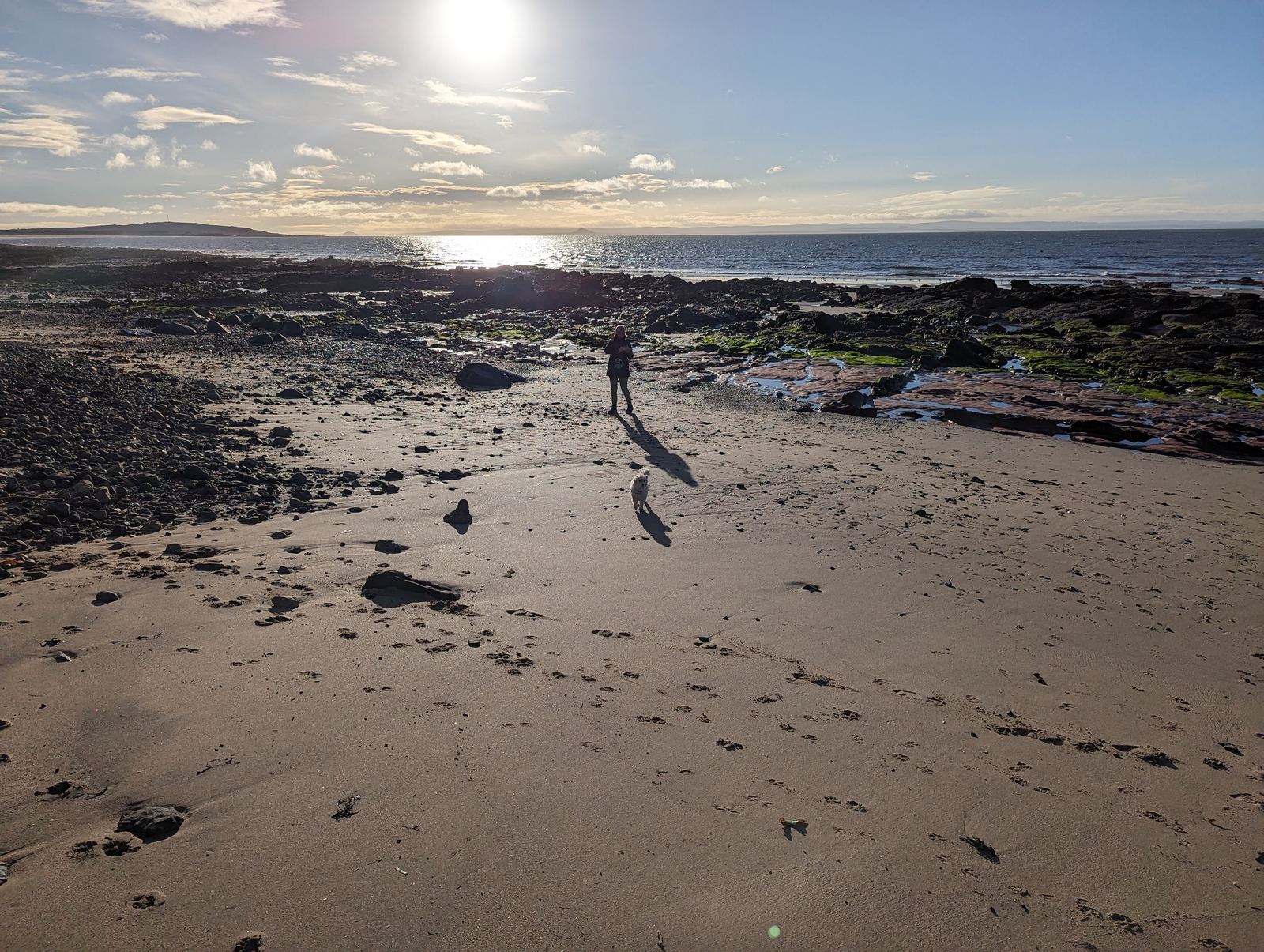The wide sands of Largo Bay at low tide, a lone walker on the beach
