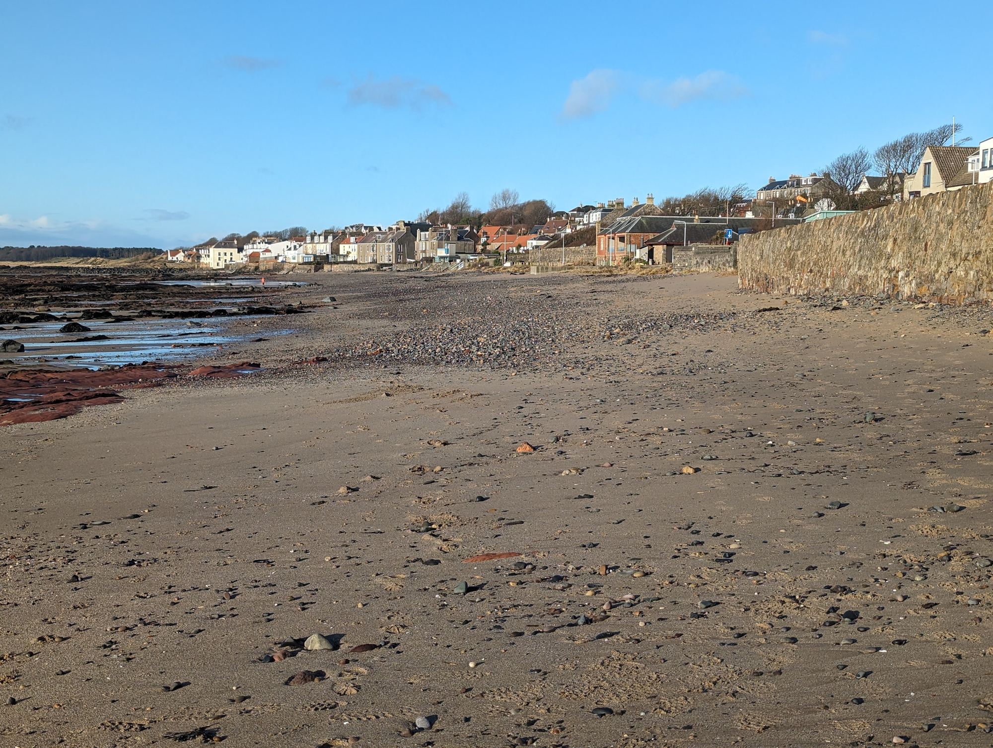 The sandy beach at Lower Largo with the Seatown cottages of the village behind