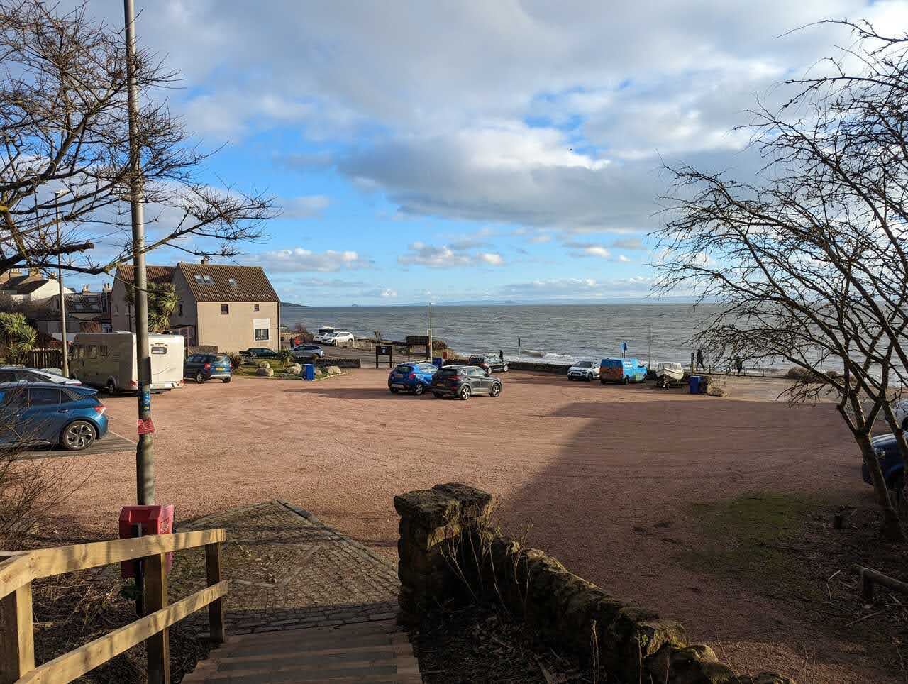 The bay and seafront at Lower Largo, houses strung along the shore