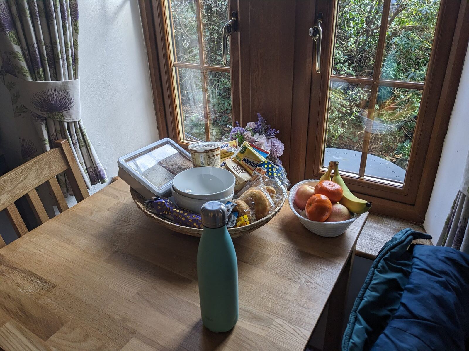 A simple continental breakfast tray by a window at Alderdale B&B in Luss.