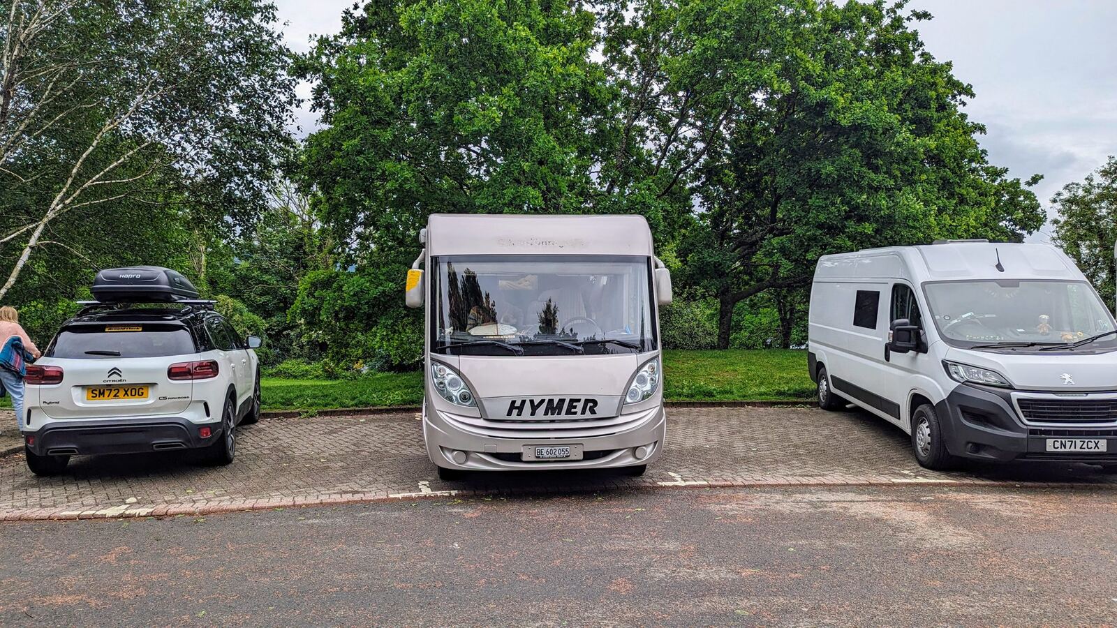 A motorhome and cars in the Luss car park by Loch Lomond the next morning.