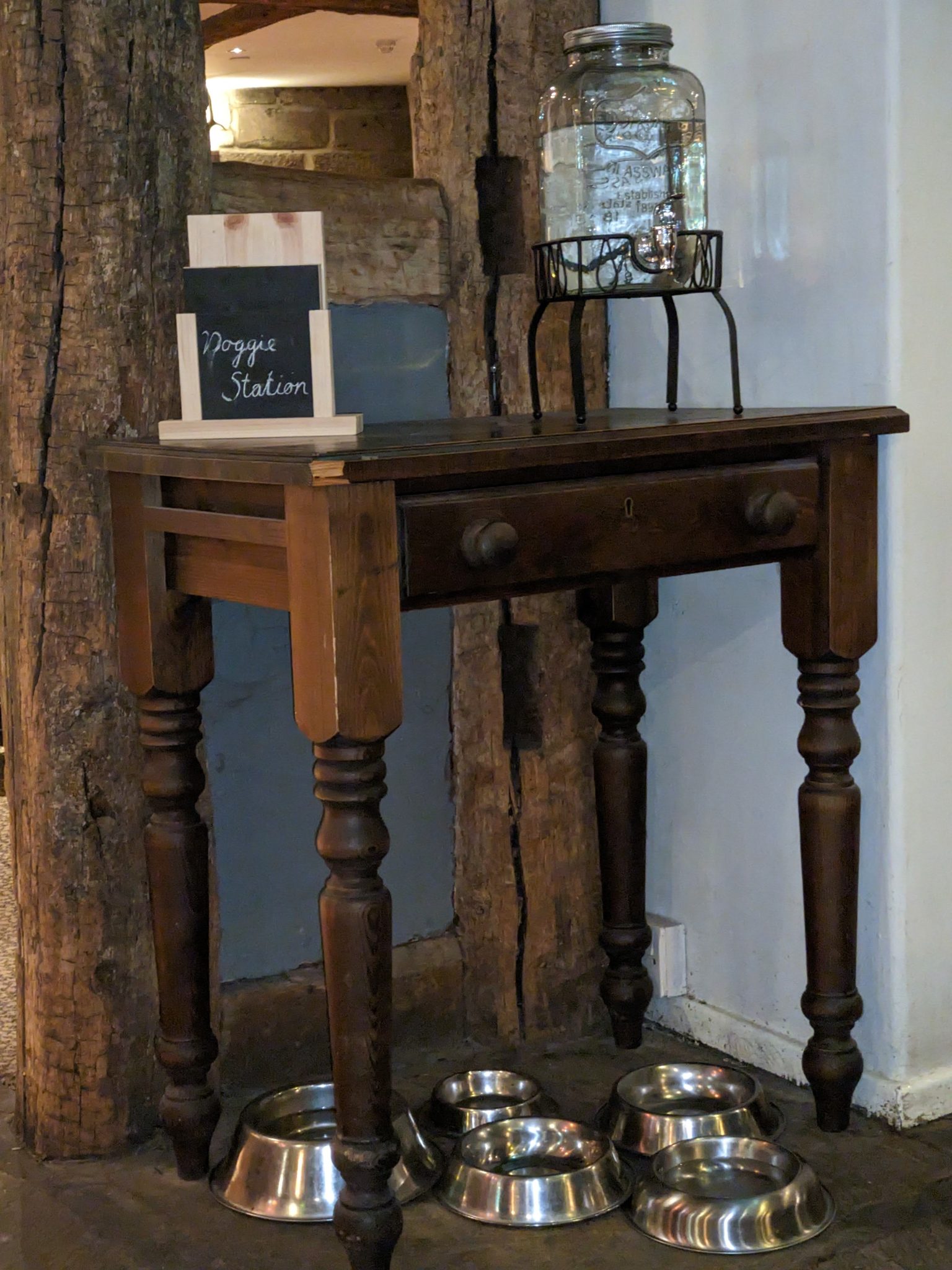A 'doggie station' with water bowls inside a dog-friendly inn at Luss.