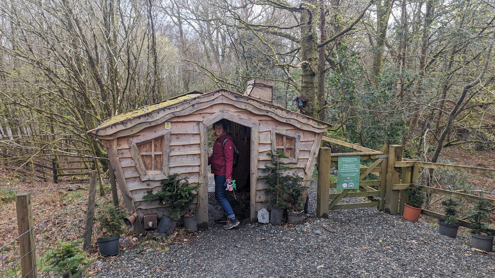 A wooden fairy cabin house among the trees on the Loch Lomond fairy trail at Luss.