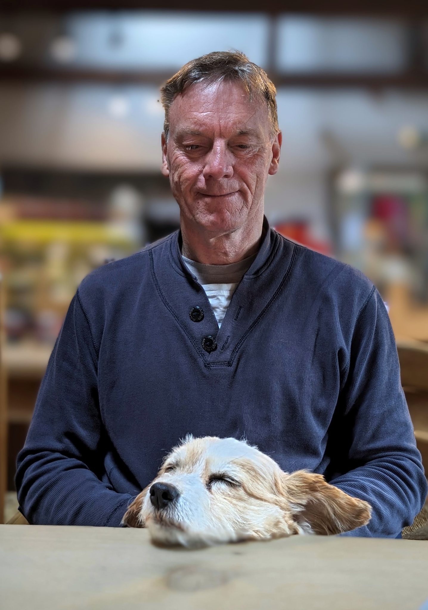 Kevin holding Lillie the dog in the village at Luss.