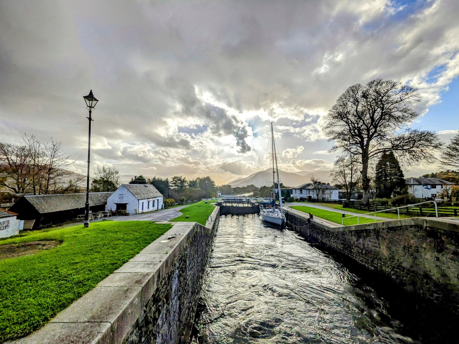 The staircase of locks at Neptune's Staircase under a dramatic sky.