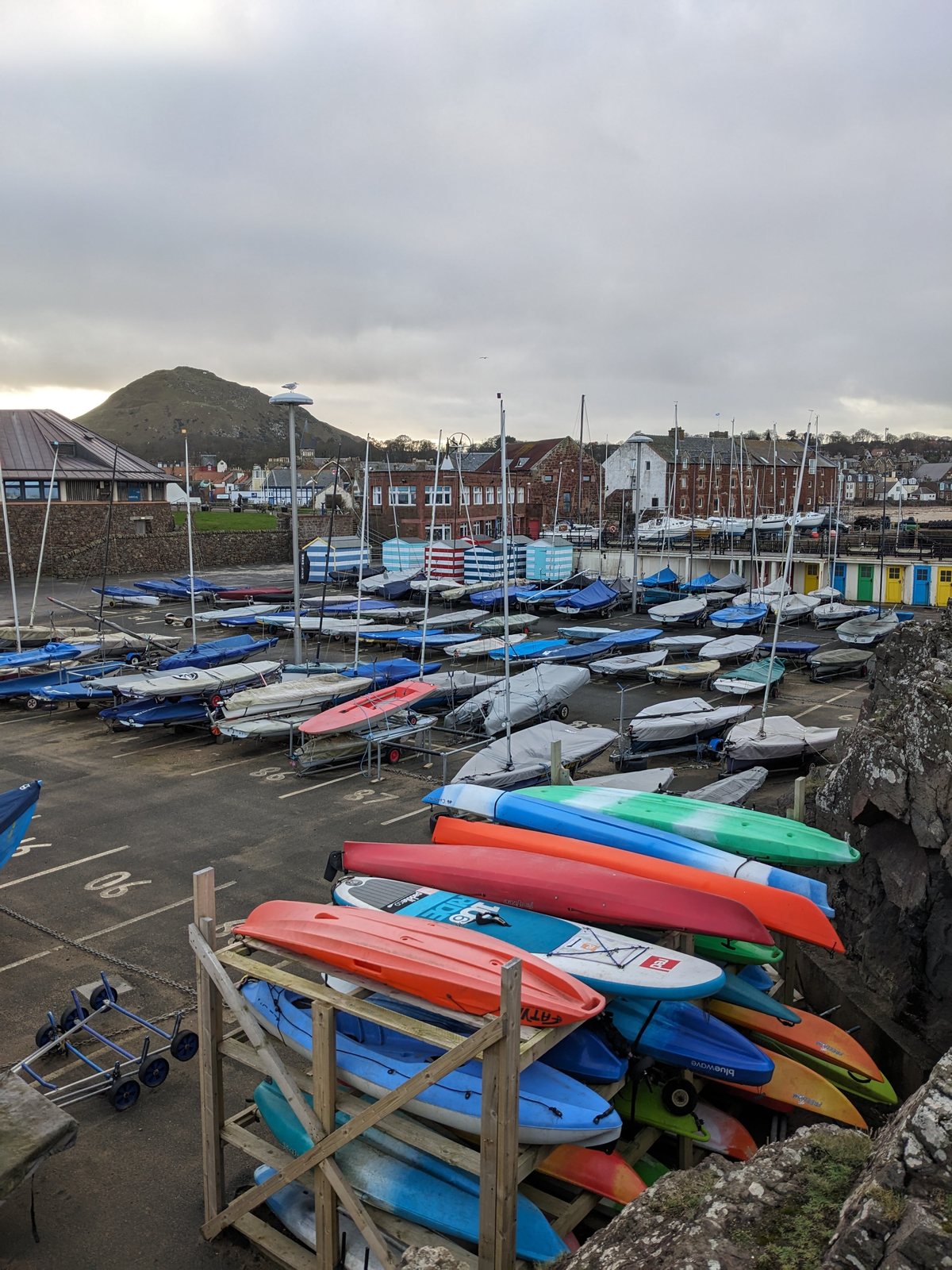 Kayaks racked at North Berwick harbour.