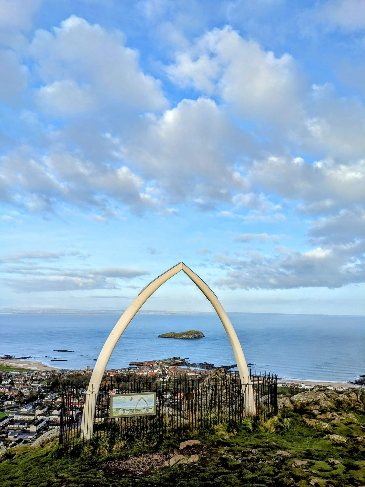 The whale-jawbone arch on the summit of North Berwick Law, the Firth of Forth and Bass Rock beyond.