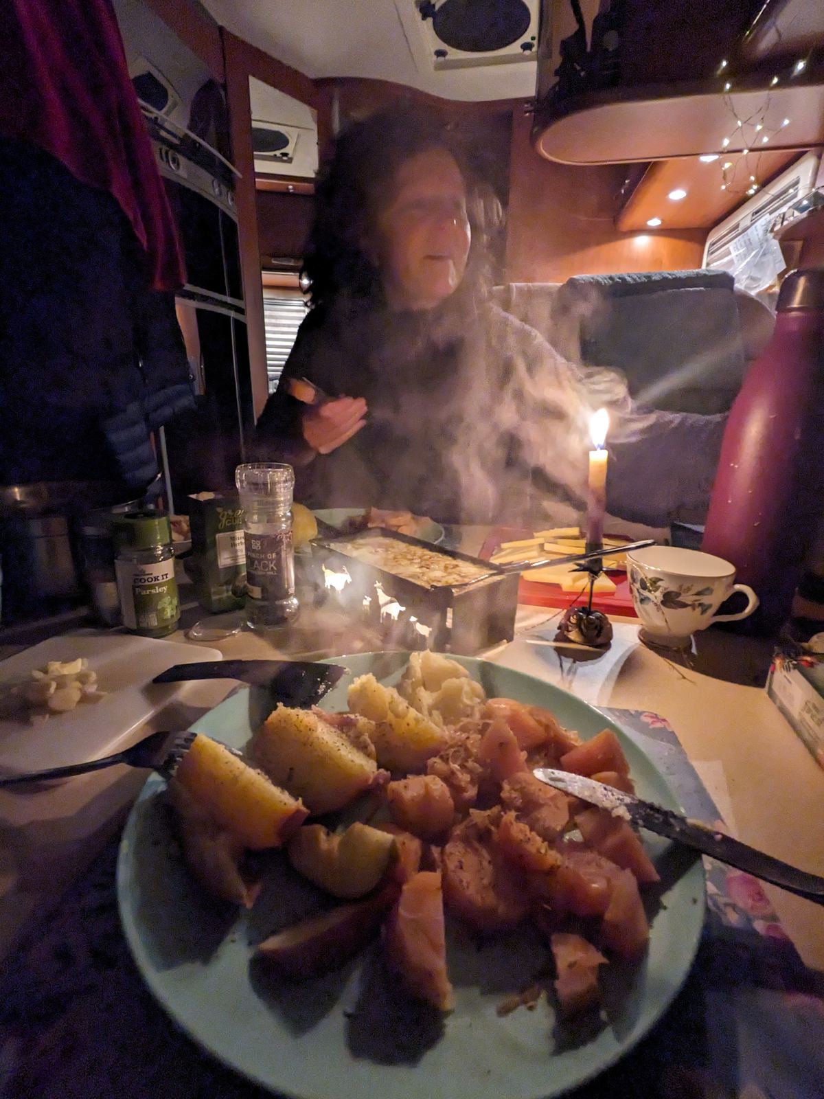 A cosy candlelit dinner inside the motorhome on a winter evening at North Berwick.