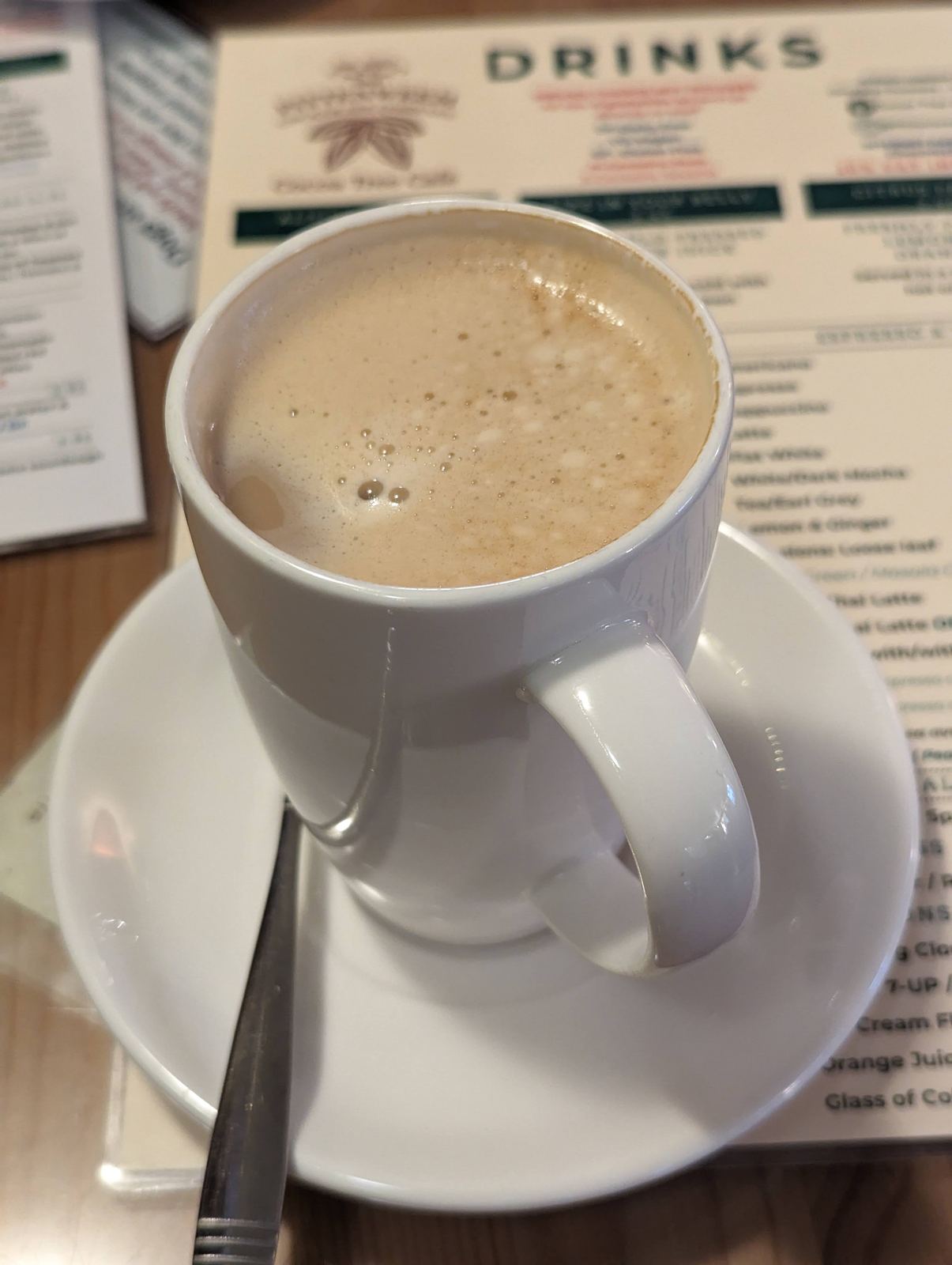 Coffee at the Cocoa Tree Cafe, Pittenweem, with the drinks menu behind