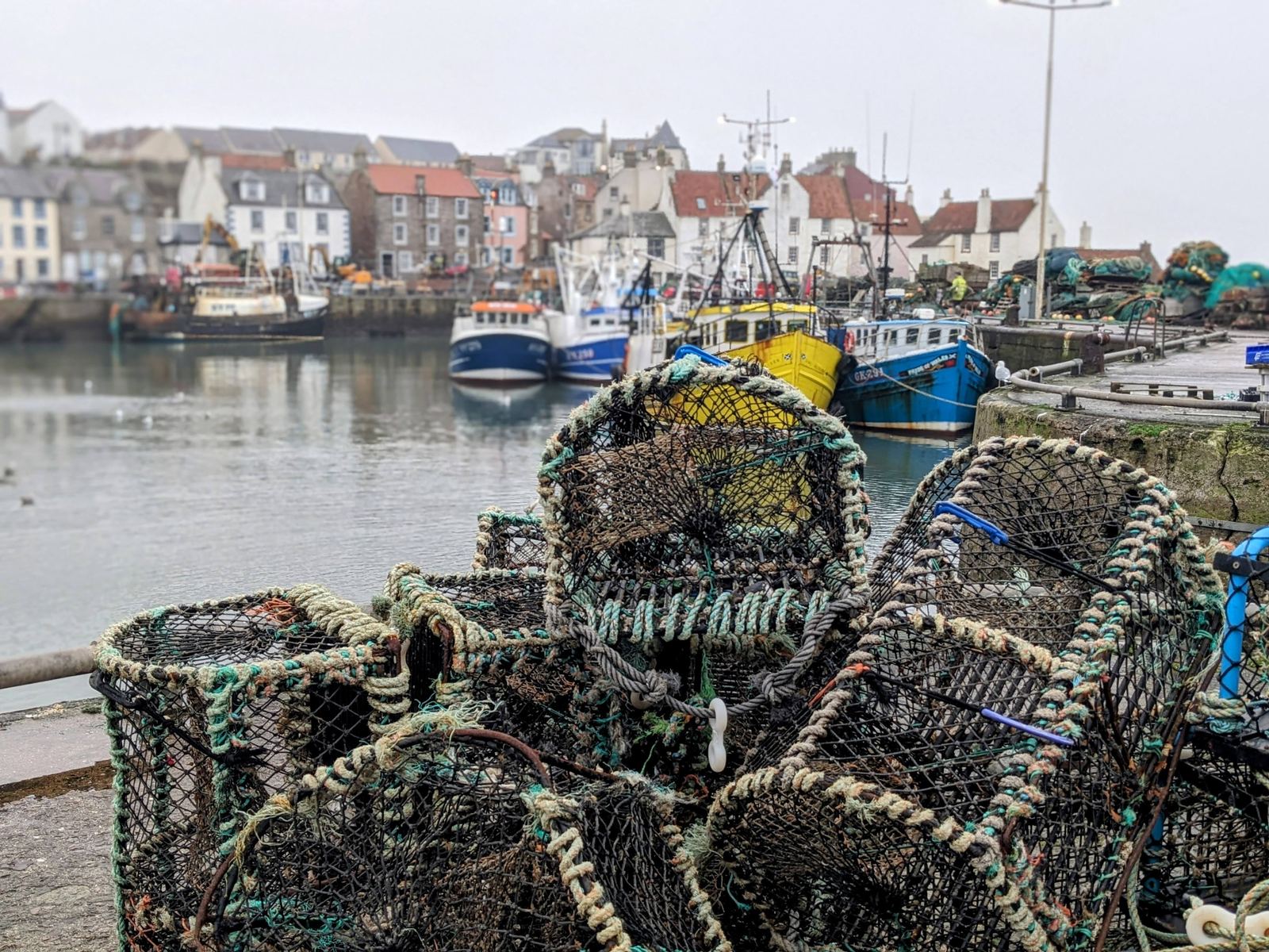Stacked creels (lobster pots) on the quay at Pittenweem