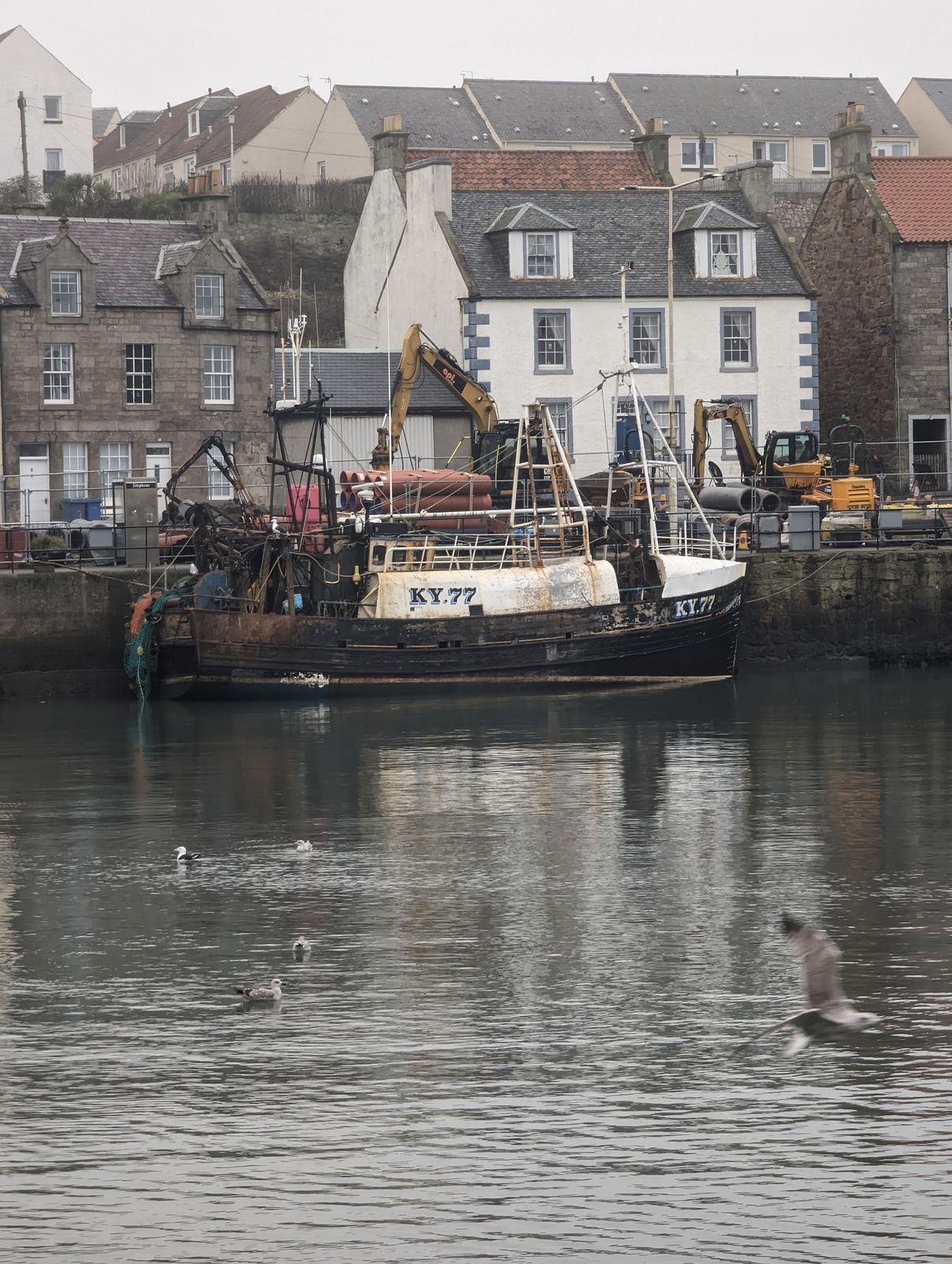 Fishing boats and waterfront cottages at Pittenweem harbour