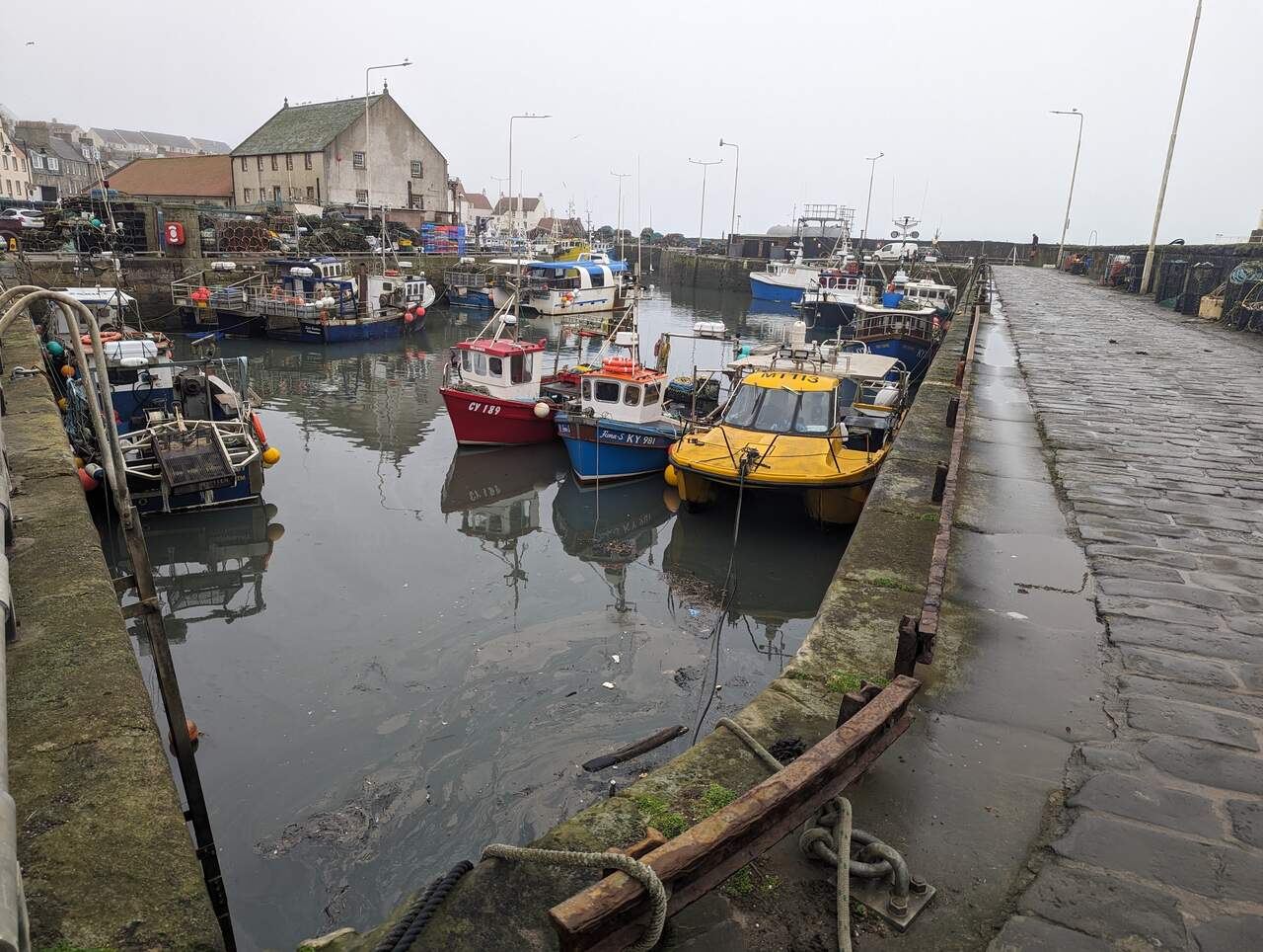 Pittenweem harbour and the fish market building on a grey winter day