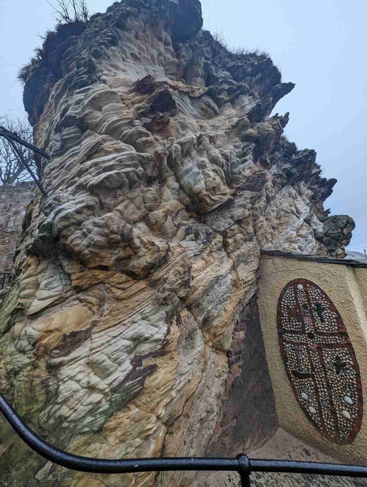 A carved stone relief on the rock near St Fillan's Cave, Pittenweem