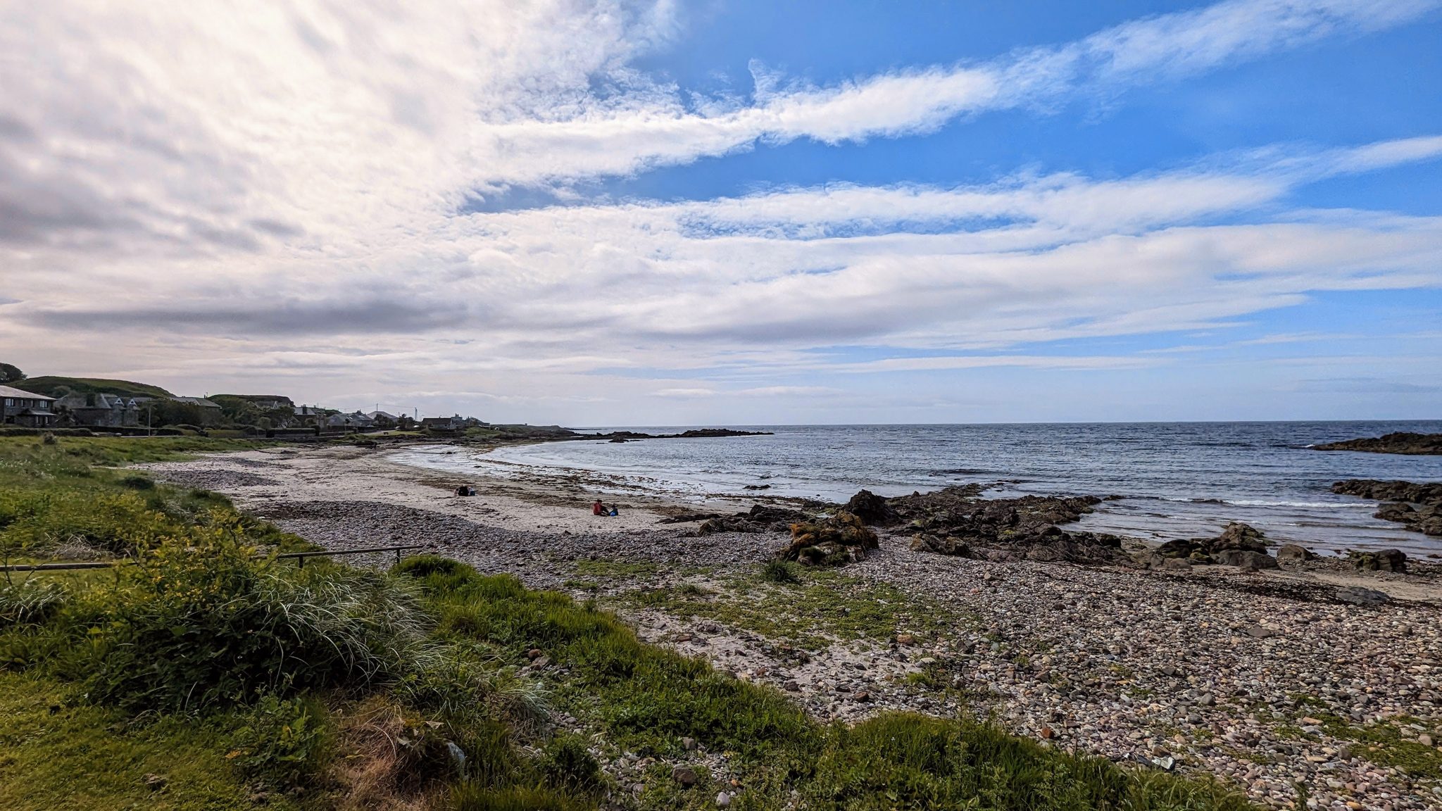 The view from the free shore car park at Southend across the beach and sea to the horizon.