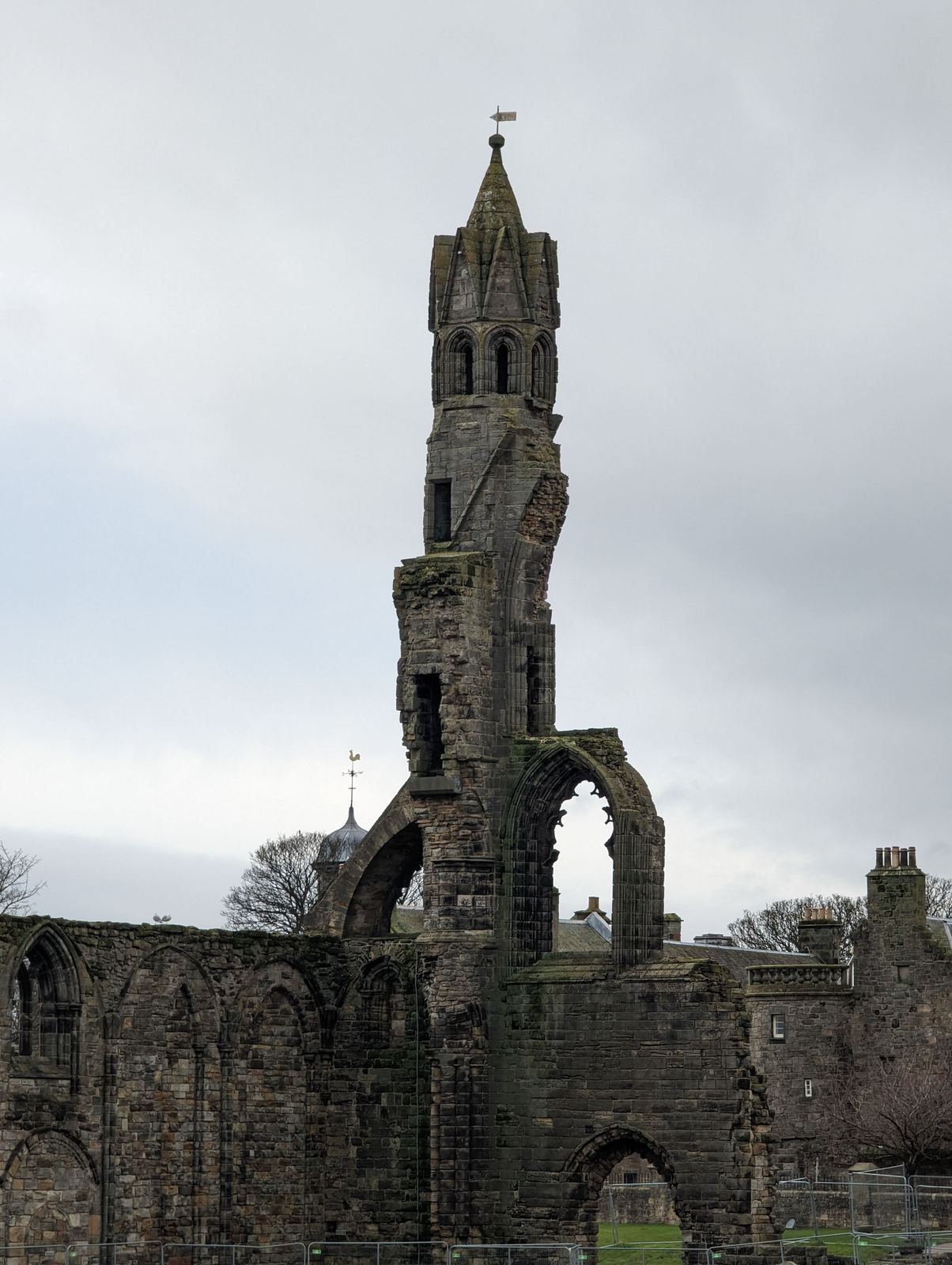 The soaring ruined east gable and tower of St Andrews Cathedral against the sky.