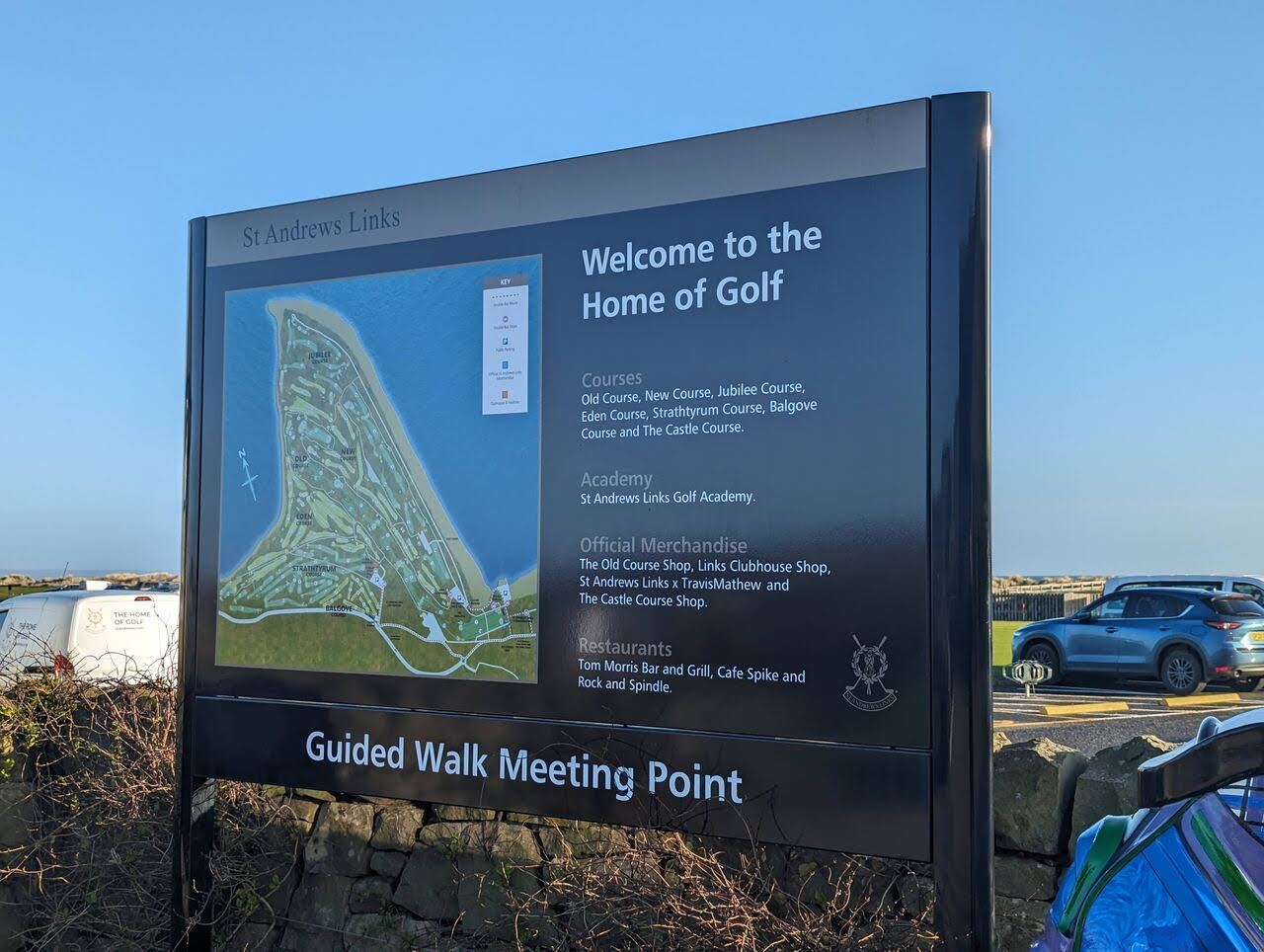 A 'Welcome to the Home of Golf' map board at St Andrews Links.