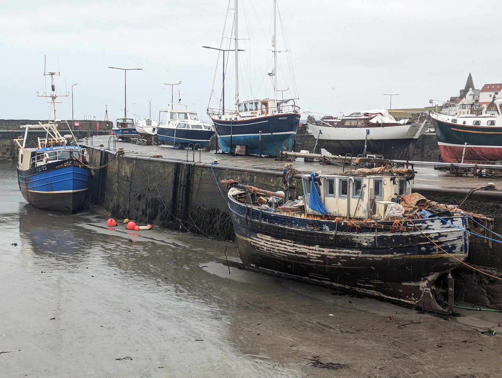 Fishing and pleasure boats on the harbour mud at St Monans.