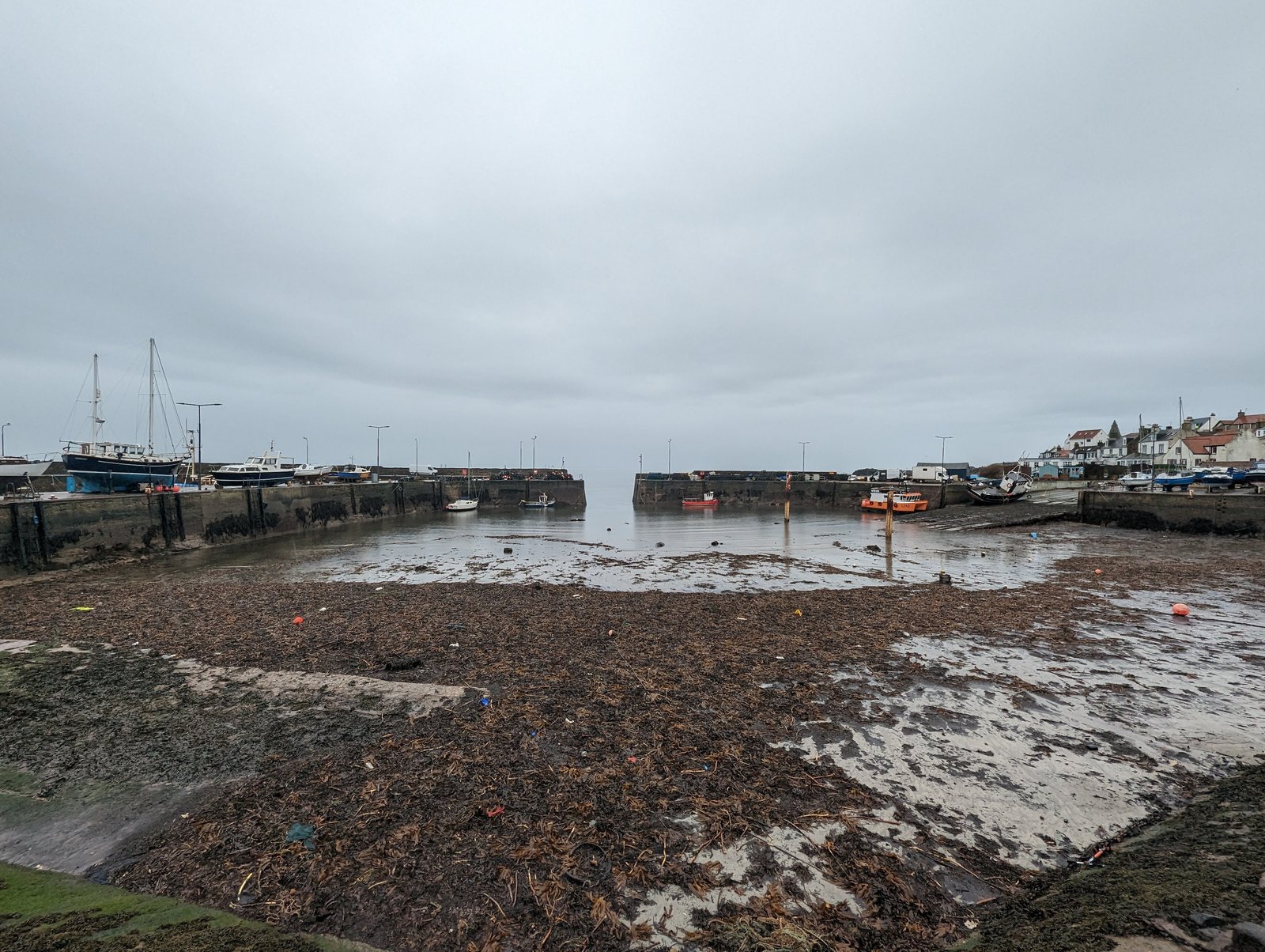 St Monans harbour mouth open to the Firth of Forth at low water.