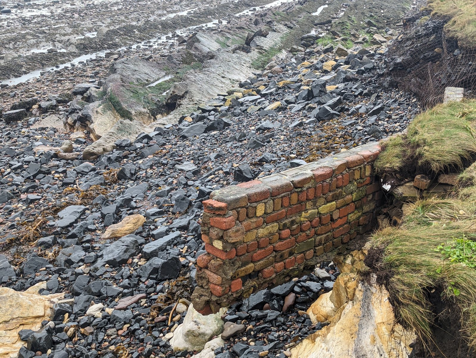 Brick and stone remains of the old salt pans on the shore at St Monans.
