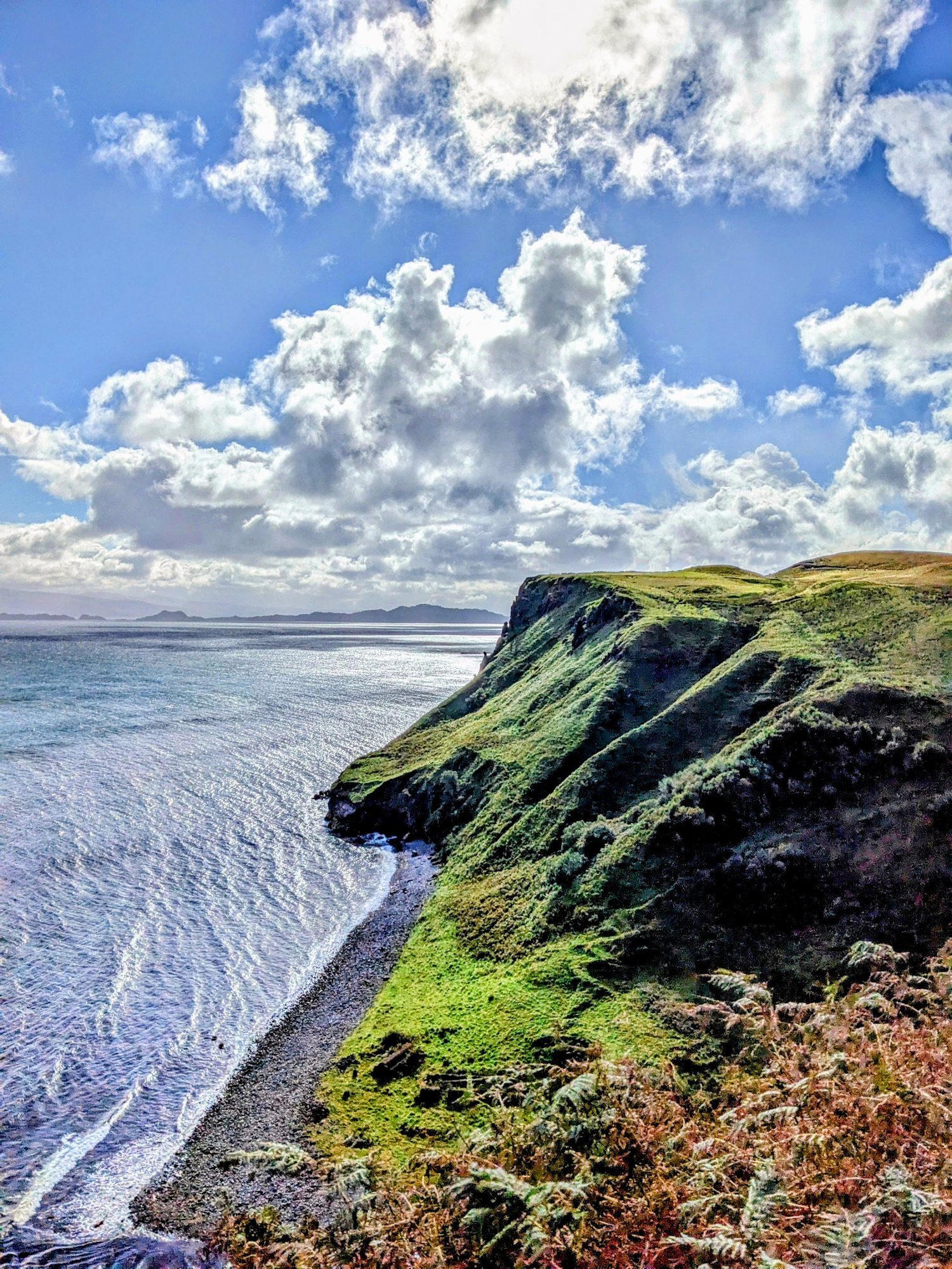 Mealt Falls plunging off the Kilt Rock cliffs into the sea near Staffin, Skye.