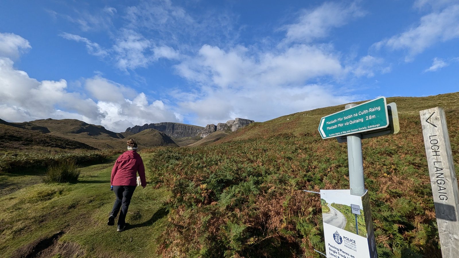 A walker heading off along a path on the Trotternish peninsula.