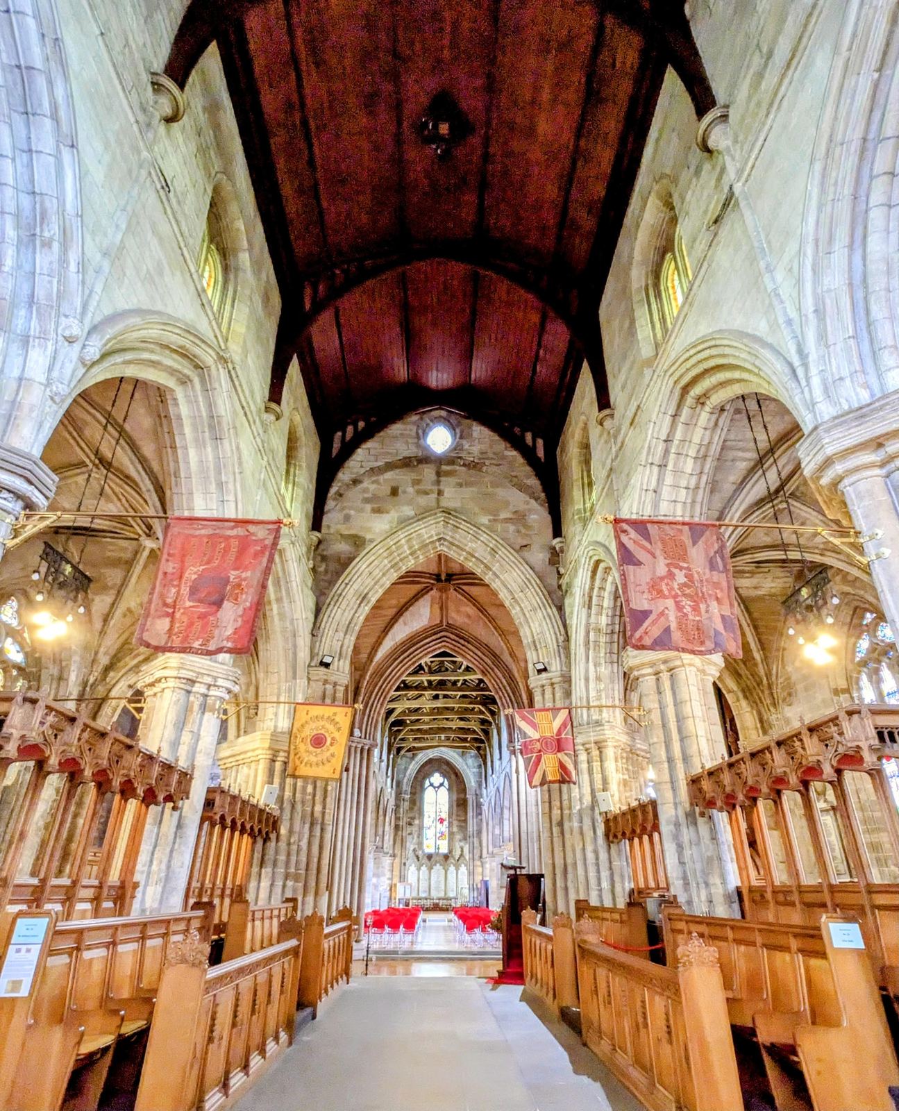 The medieval stone nave of the Church of the Holy Rude in Stirling, tall pillars and a timber roof.