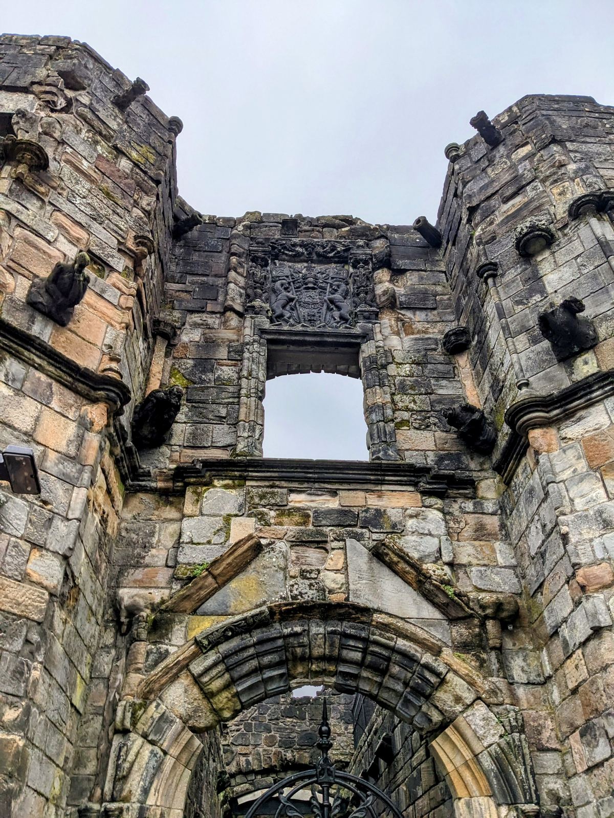 The ornate carved stone facade of Mar's Wark, a ruined Renaissance townhouse on Stirling's old town street.