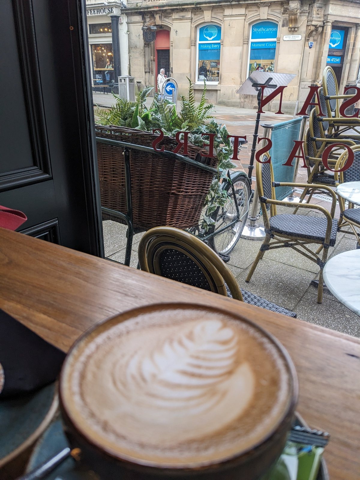 A latte in a cafe in Stirling Old Town.