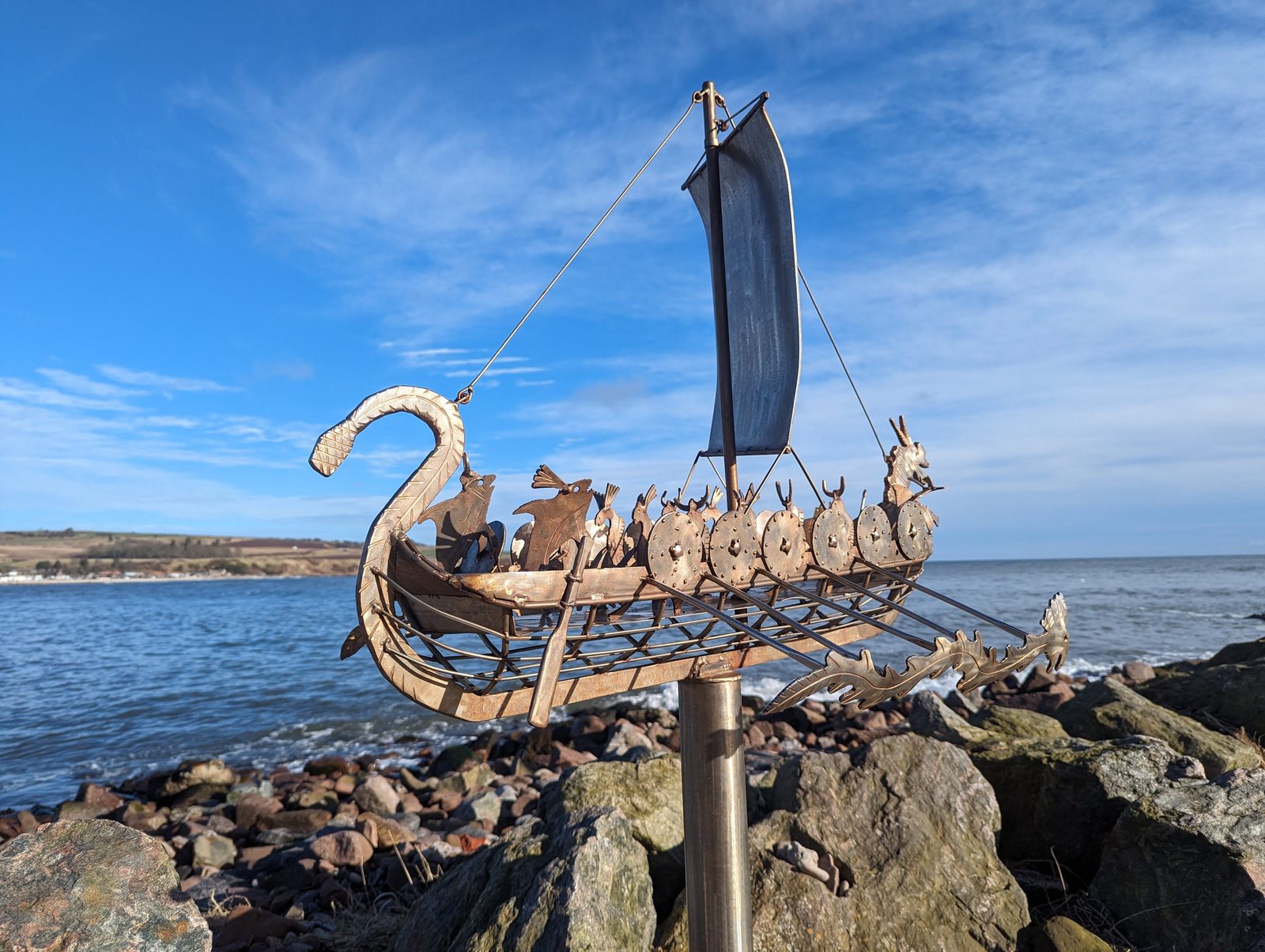 A Viking longship sculpture against a blue winter sky, Stonehaven.