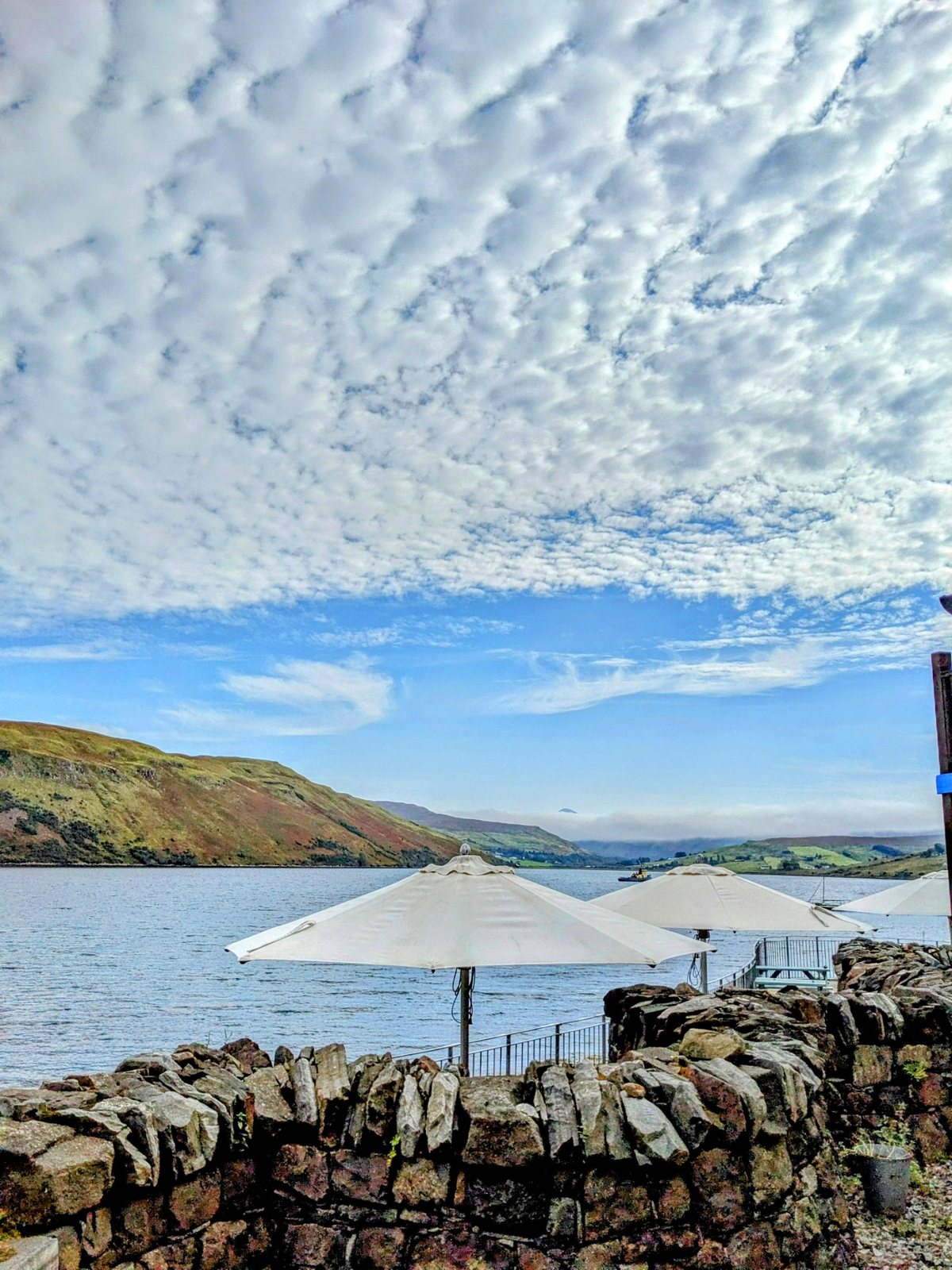 Café tables by the water at Carbost.