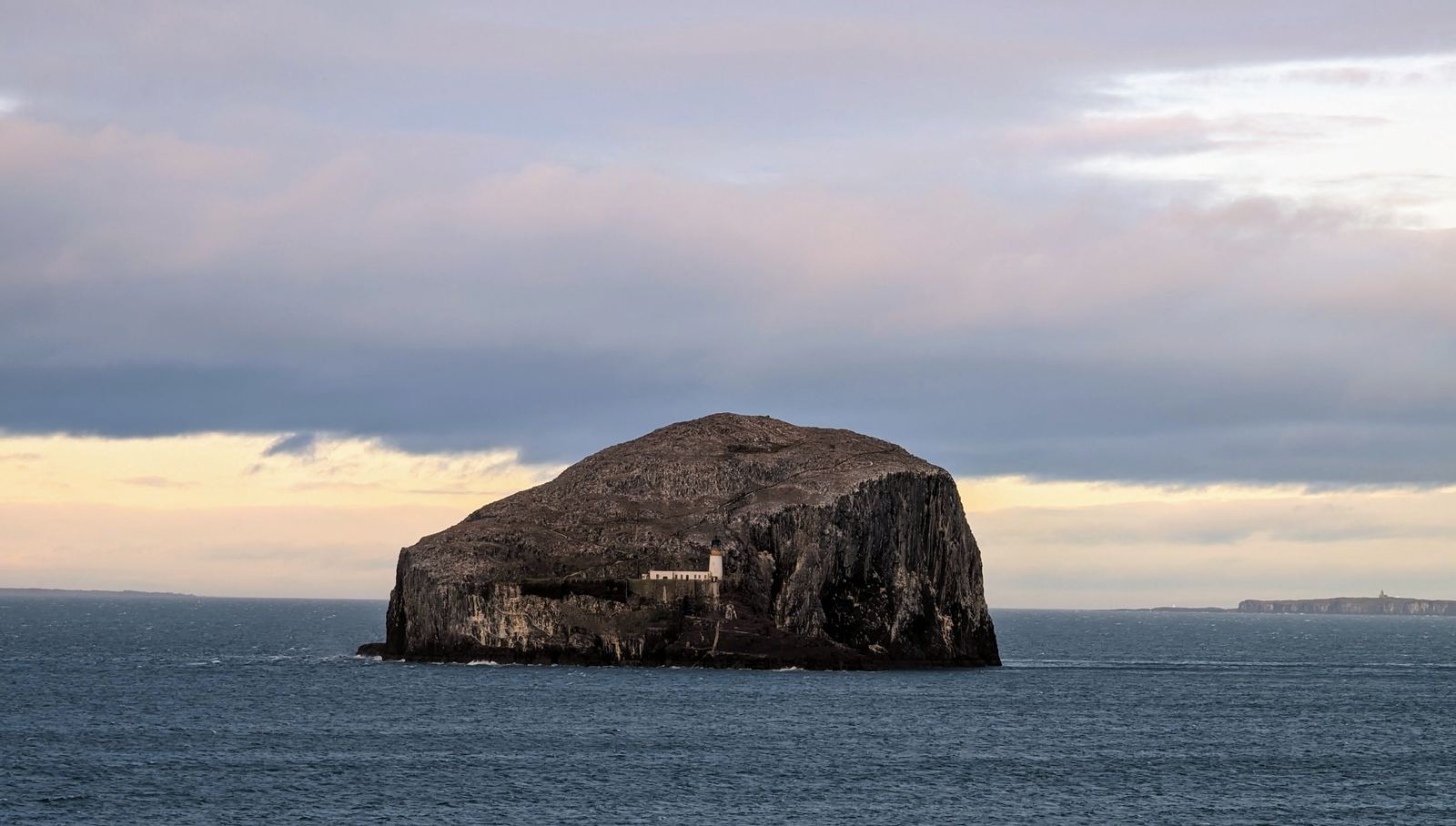 Bass Rock rising from the sea, seen from Tantallon Castle.