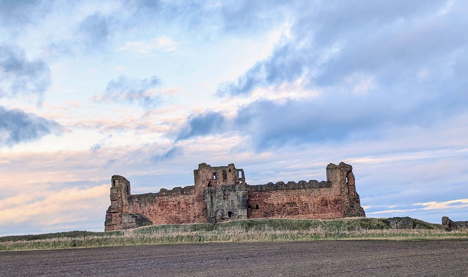 Tantallon Castle at dusk on its clifftop, East Lothian.