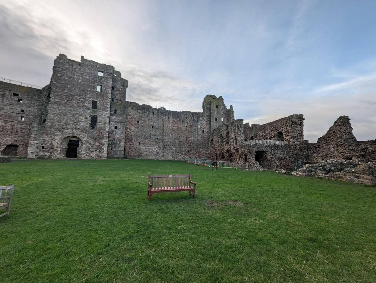 The inner ruins and towers of Tantallon Castle against a big sky.