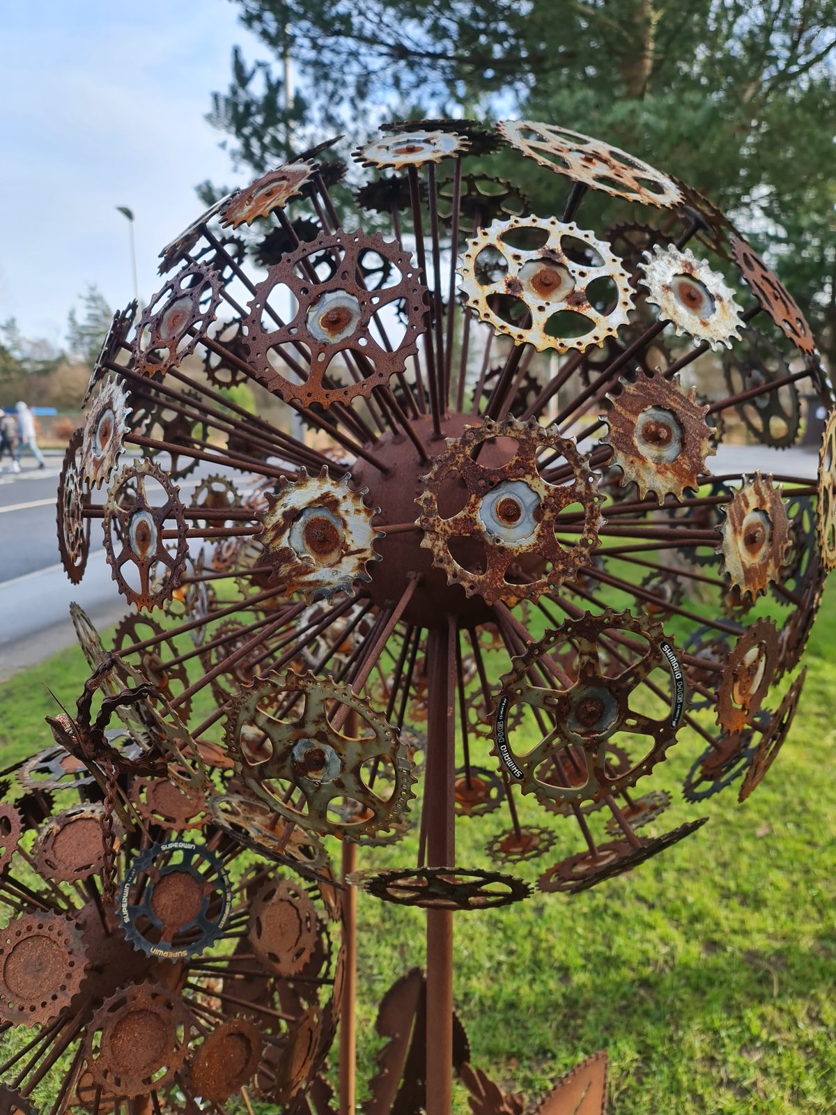 A rusted metal flower sculpture at the Helix, Falkirk.