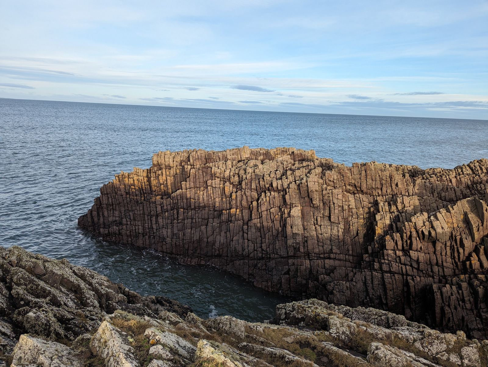 Layered rock sea cliffs on the coast at Tyninghame.