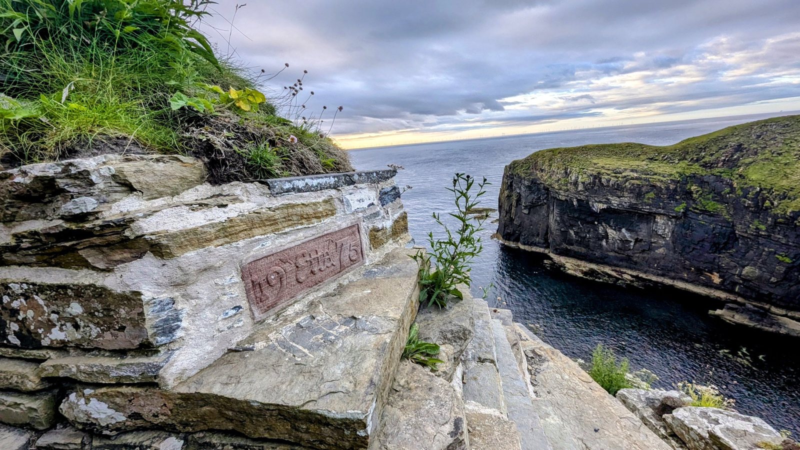 The old stone harbour wall in the geo at Whaligoe.
